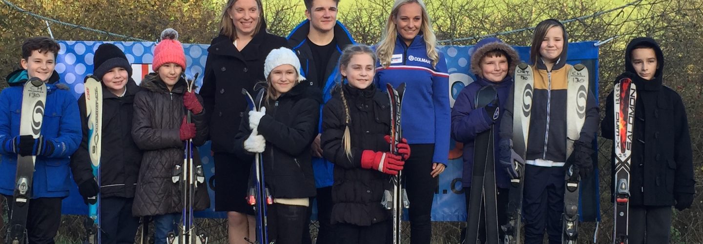 Sports Minister Tracey Crouch with Mike Rowlands and Charlotte Evans and pupils from Hempstead Junior School low res